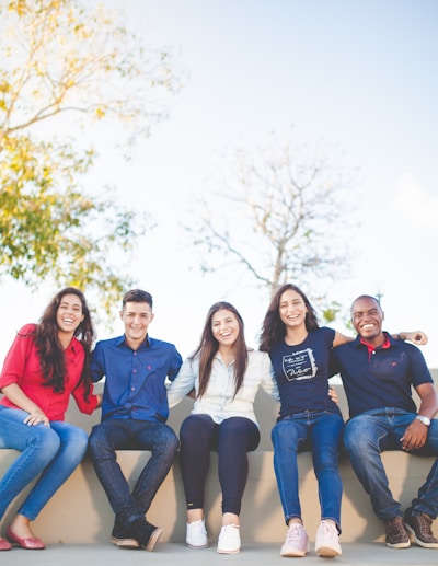 Diverse group of students celebrating successful visa approval